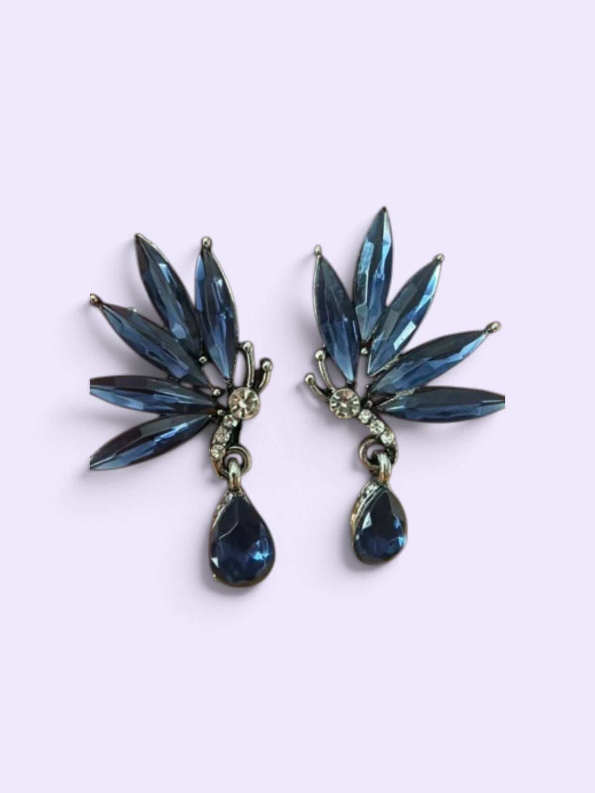 Calilo Australia butterfly-inspired drop earrings with midnight-blue marquise crystals and clear pavé accents.