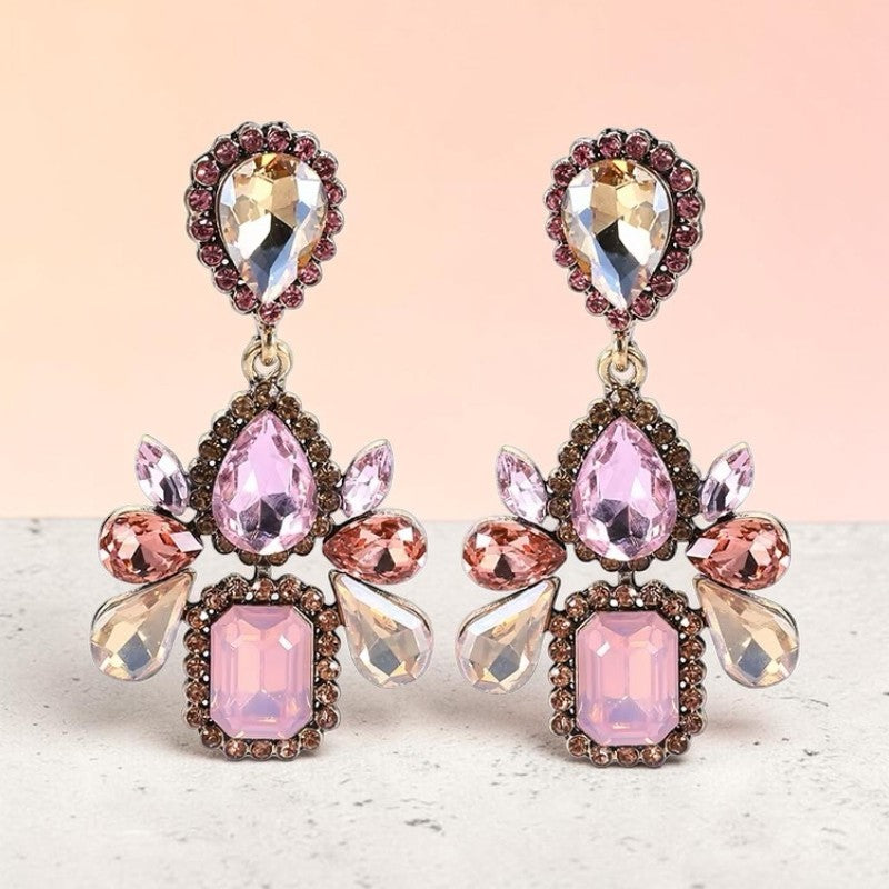 Calilo Australia statement drop earrings featuring blush, champagne, and rose crystals in an antique metal setting.