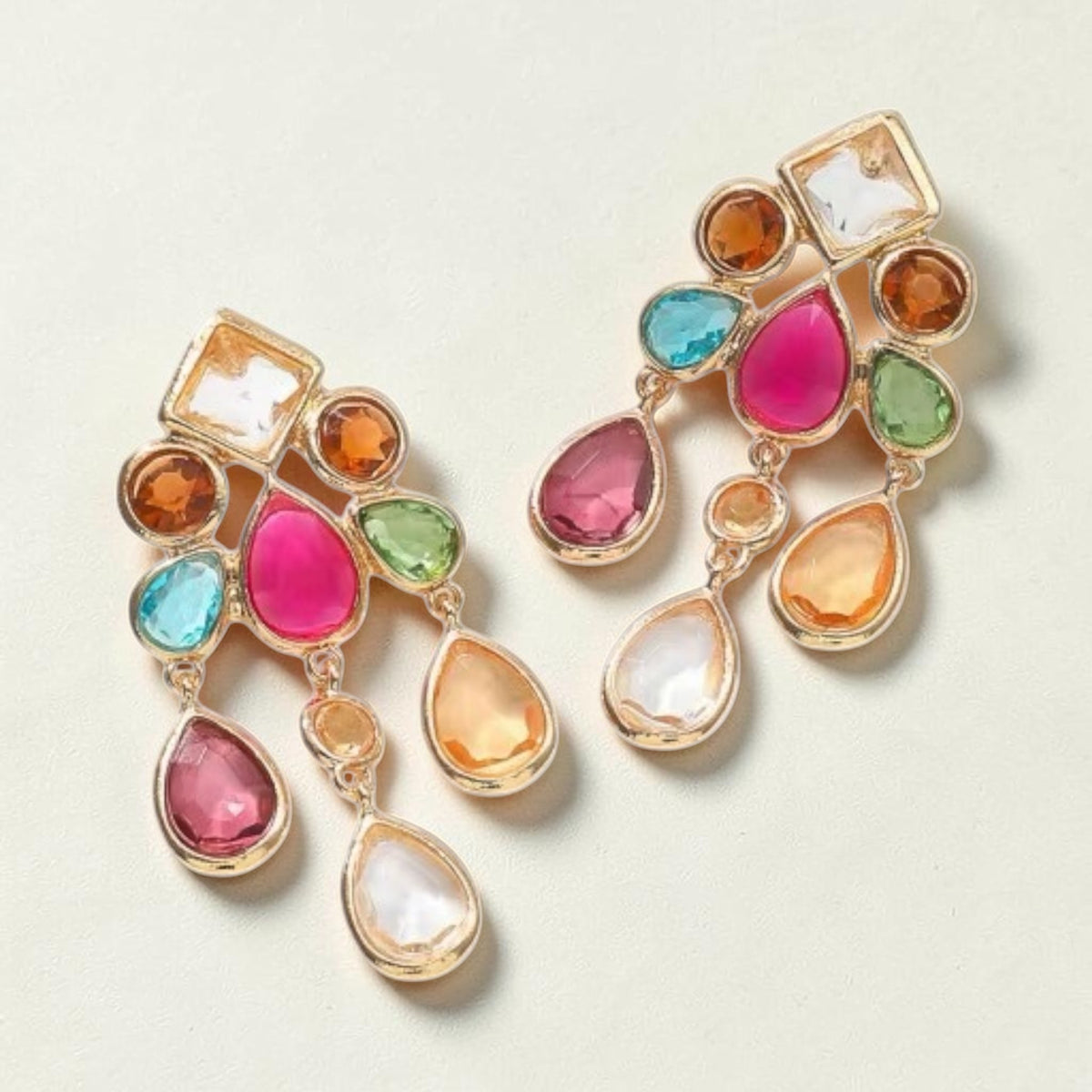 Calilo Australia Estelle chandelier earrings featuring multi-colored faceted teardrop crystals in a gold-tone setting.
