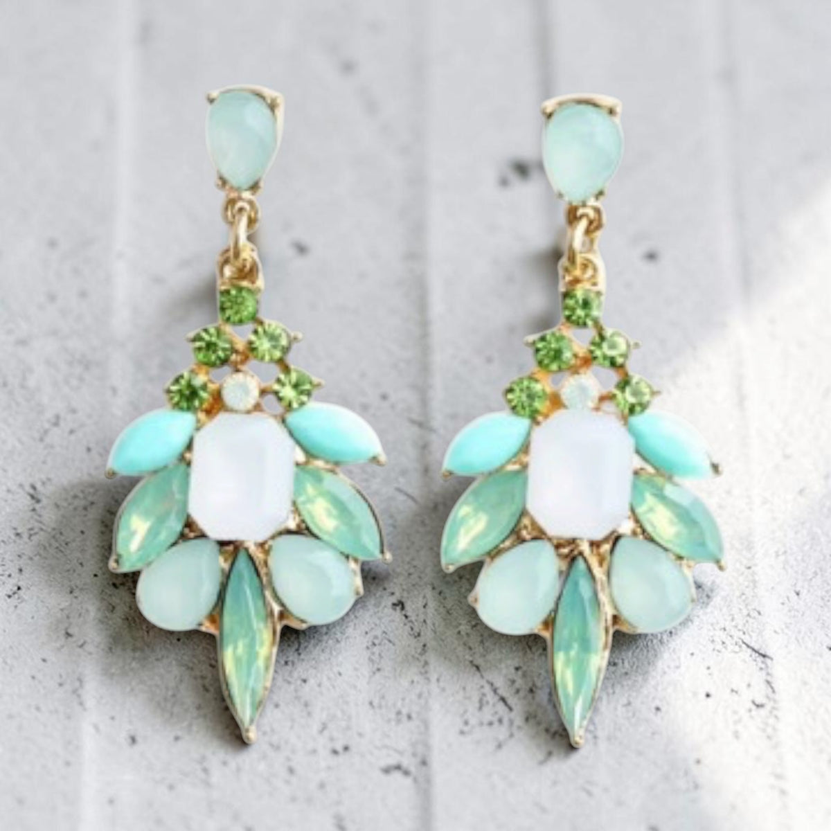 Calilo Australia statement drop earrings featuring mint, lime green, and white gemstones on a gold-tone base.
