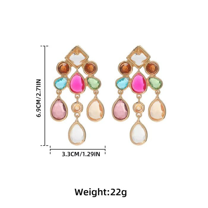 Calilo Australia statement chandelier earrings featuring gold-tone metal and multi-colored faceted teardrop crystals.