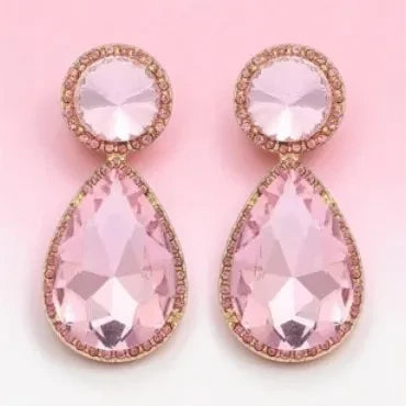 Calilo Australia teardrop statement earrings featuring blush pink crystals with pavé halos in a gold-toned setting.