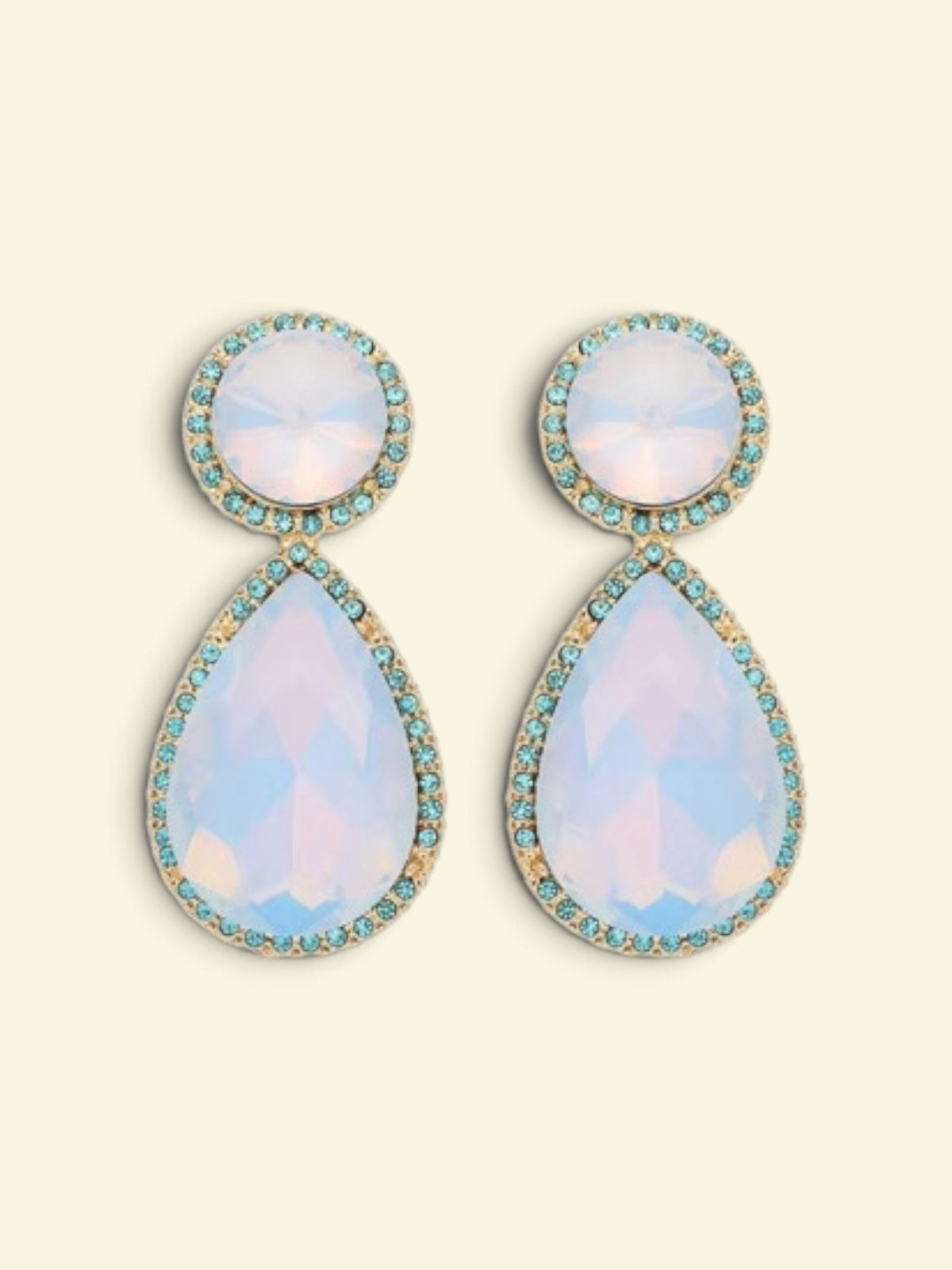 Calilo Australia gold-toned teardrop statement earrings with iridescent stones and blue crystal halo accents.